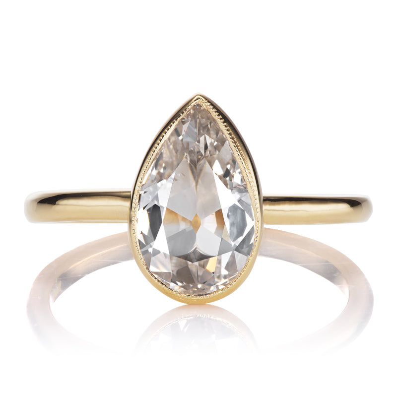 1 Carat Pear Cut in 18kt Yellow Gold Bezel Setting with Millegrain